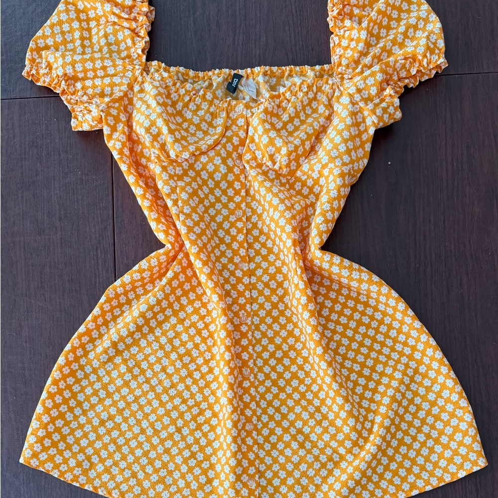 Divided Orange Blouse with White Floral Pattern